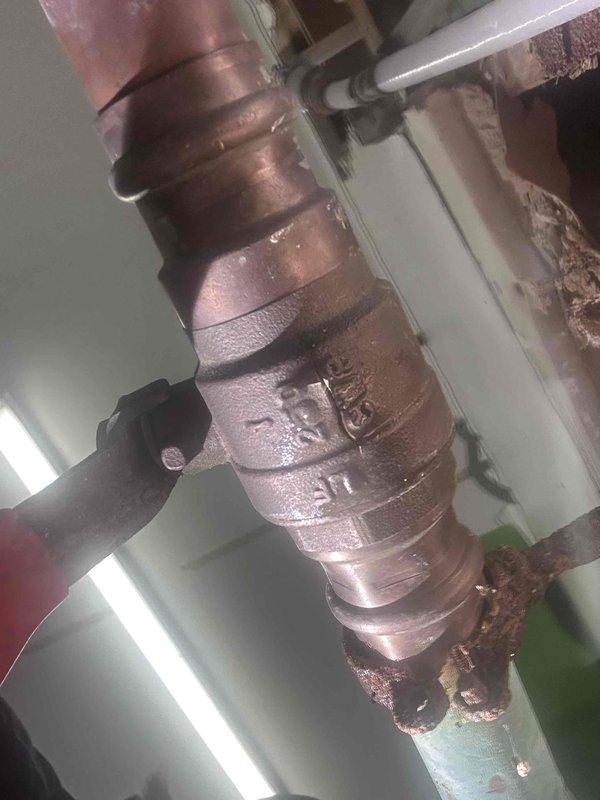 Responded to service call regarding leak in pump room. Upon inspection, identified corrosion and mineral buildup at copper pipe joints causing water leakage. Removed damaged pipe section showing significant oxidation and deterioration, and replaced with new copper fittings to restore proper system function. Responded to service call regarding leak in pump room. Upon inspection, identified corrosion and mineral buildup at copper pipe joints causing water leakage. Removed damaged pipe section showing significant oxidation and deterioration, and replaced with new copper fittings to restore proper system function.