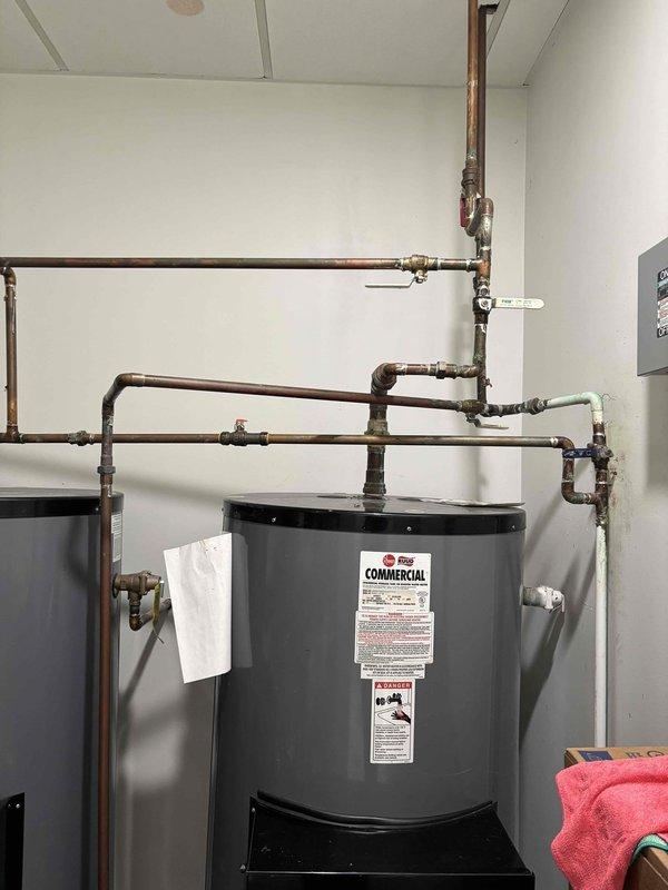 Completed estimate for installation of a water supply line to accommodate two shampoo bowls. Inspection revealed high water pressure (110-120 psi) at the existing water heater location, which will require pressure regulation for the new installation. Documented existing copper plumbing configuration to plan appropriate tie-in points for the new waterline. Completed estimate for installation of a water supply line to accommodate two shampoo bowls. Inspection revealed high water pressure (110-120 psi) at the existing water heater location, which will require pressure regulation for the new installation. Documented existing copper plumbing configuration to plan appropriate tie-in points for the new waterline.