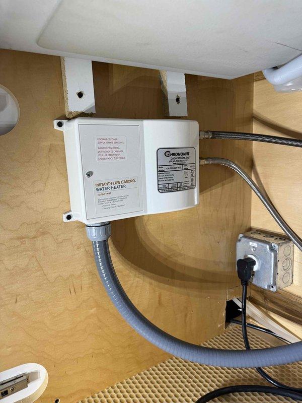 Cleared kitchen sink clog and successfully installed customer-supplied under-sink instantaneous micro water heater from Chronomite Laboratories. Properly connected water lines with appropriate braided supply lines and ensured electrical connection was secure and compliant with code requirements. Cleared kitchen sink clog and successfully installed customer-supplied under-sink instantaneous micro water heater from Chronomite Laboratories. Properly connected water lines with appropriate braided supply lines and ensured electrical connection was secure and compliant with code requirements.