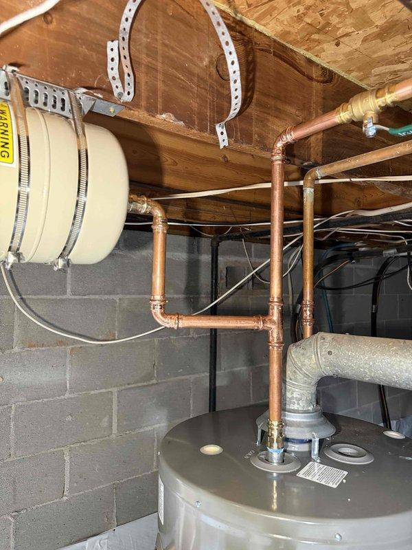 Diagnosed non-functioning water heater in crawlspace that customer had powered off. Pressure gauge testing revealed excessive system pressure (160-170 psi), significantly above normal operating range. Inspected copper plumbing connections and determined pressure issue was causing water heater failure. Diagnosed non-functioning water heater in crawlspace that customer had powered off. Pressure gauge testing revealed excessive system pressure (160-170 psi), significantly above normal operating range. Inspected copper plumbing connections and determined pressure issue was causing water heater failure.