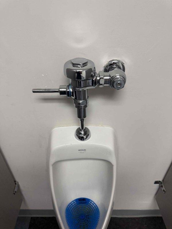 Inspected men's restroom facilities and identified two urinal issues: one urinal with a leaking flush handle and another non-operational unit. Both Kohler fixtures were examined, with particular attention to the flush valve assemblies. Repaired leaking handle by replacing worn valve components and restored functionality to the inoperative unit. Inspected men's restroom facilities and identified two urinal issues: one urinal with a leaking flush handle and another non-operational unit. Both Kohler fixtures were examined, with particular attention to the flush valve assemblies. Repaired leaking handle by replacing worn valve components and restored functionality to the inoperative unit.