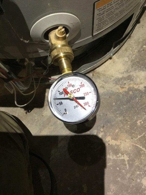 Inspected bathroom plumbing system to diagnose recurring backup issues affecting toilets and tubs on upper level. Identified potential double wye configuration requiring attention. Performed pressure testing with gauge reading approximately 125-130 PSI, which was documented with photographs along with ceiling access point marked for future reference. Inspected bathroom plumbing system to diagnose recurring backup issues affecting toilets and tubs on upper level. Identified potential double wye configuration requiring attention. Performed pressure testing with gauge reading approximately 125-130 PSI, which was documented with photographs along with ceiling access point marked for future reference.