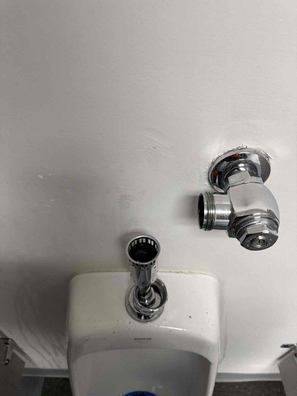 Replaced worn flushometer components on urinal fixture. Removed existing valve assembly, installed new parts, and verified proper operation of the flush mechanism. All connections were secured and tested to ensure no leaks in the chrome plumbing assembly. Replaced worn flushometer components on urinal fixture. Removed existing valve assembly, installed new parts, and verified proper operation of the flush mechanism. All connections were secured and tested to ensure no leaks in the chrome plumbing assembly.