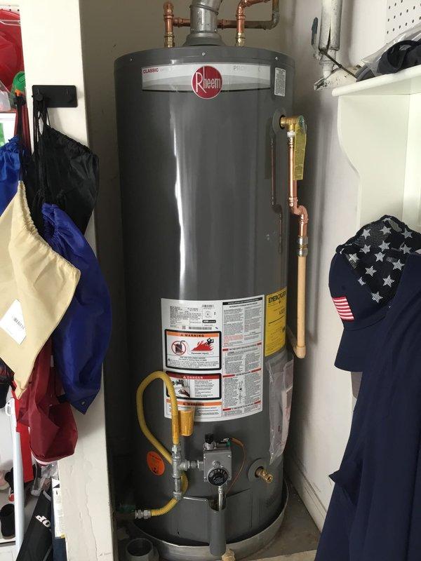 Inspected Rheem water heater that had accumulated water in the drain pan. Performed visual assessment of the unit and surrounding plumbing connections, noting proper installation of P-trap assembly and all associated piping. Verified functionality of water heater components and checked for source of leak. Inspected Rheem water heater that had accumulated water in the drain pan. Performed visual assessment of the unit and surrounding plumbing connections, noting proper installation of P-trap assembly and all associated piping. Verified functionality of water heater components and checked for source of leak.