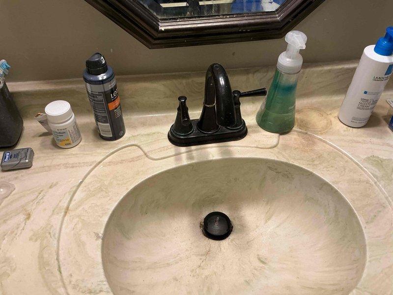 # Service Report
## Job Description
Responded to service call for no hot water at kitchen sink and spare bathroom located directly above kitchen area. Issue occurred after customer's dishwasher replacement. Upon investigation, determined that hot water supply lines had been improperly reconnected or shut off during dishwasher installation work.
Accessed spare bathroom faucet assembly and disassembled two-handle fixture to diagnose water flow issue. Identified problem with hot water supply valve or cartridge requiring replacement. Removed old faucet cartridge and associated components including brass washers and O-rings. Installed new cartridge assembly with replacement seals to restore proper hot water flow to bathroom fixture.
Verified hot water supply lines were properly connected and valves fully opened at both kitchen and bathroom locations. Tested water temperature and flow at both fixtures to confirm hot water restoration. Reassembled bathroom faucet hardware and verified no # Service Report
## Job Description
Responded to service call for no hot water at kitchen sink and spare bathroom located directly above kitchen area. Issue occurred after customer's dishwasher replacement. Upon investigation, determined that hot water supply lines had been improperly reconnected or shut off during dishwasher installation work.
Accessed spare bathroom faucet assembly and disassembled two-handle fixture to diagnose water flow issue. Identified problem with hot water supply valve or cartridge requiring replacement. Removed old faucet cartridge and associated components including brass washers and O-rings. Installed new cartridge assembly with replacement seals to restore proper hot water flow to bathroom fixture.
Verified hot water supply lines were properly connected and valves fully opened at both kitchen and bathroom locations. Tested water temperature and flow at both fixtures to confirm hot water restoration. Reassembled bathroom faucet hardware and verified no