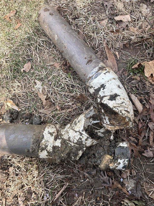 # Job Description
Completed sewer line repair involving excavation and replacement of deteriorated underground piping. Excavated access hole to expose failed sewer pipes showing severe corrosion, rust damage, and mineral buildup at connection points. Removed compromised metal pipes that exhibited extensive surface deterioration, oxidation, and structural failure. Replaced damaged sections with new piping to restore proper sewer function and prevent future leaks or blockages. Backfilled excavation and restored ground surface upon completion of repairs. # Job Description
Completed sewer line repair involving excavation and replacement of deteriorated underground piping. Excavated access hole to expose failed sewer pipes showing severe corrosion, rust damage, and mineral buildup at connection points. Removed compromised metal pipes that exhibited extensive surface deterioration, oxidation, and structural failure. Replaced damaged sections with new piping to restore proper sewer function and prevent future leaks or blockages. Backfilled excavation and restored ground surface upon completion of repairs.