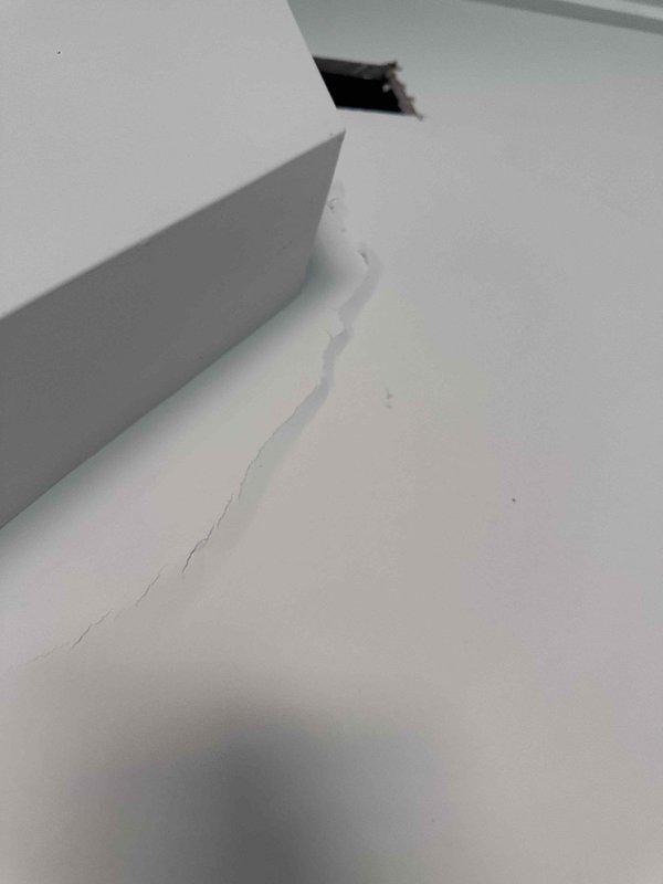 # Job Description
Responded to report of leak in garage. Upon inspection, identified active water intrusion causing structural damage to ceiling and wall assembly. Documented extensive cracking along wall-to-ceiling corner joint with visible water staining and discoloration indicating prolonged moisture exposure.
Performed exploratory opening of damaged ceiling section to assess extent of water damage and locate leak source. Removal of compromised drywall revealed saturated fiberglass insulation and affected wooden framing members. Inspected exposed ceiling joists and structural components for water damage and deterioration. Photographed conditions including compromised building materials, insulation saturation, and structural framing for documentation and further assessment.
Investigation revealed need for leak source identification and repair of water-damaged ceiling and wall materials. Recommended follow-up repairs including replacement of water-damaged drywall, insulation, and f # Job Description
Responded to report of leak in garage. Upon inspection, identified active water intrusion causing structural damage to ceiling and wall assembly. Documented extensive cracking along wall-to-ceiling corner joint with visible water staining and discoloration indicating prolonged moisture exposure.
Performed exploratory opening of damaged ceiling section to assess extent of water damage and locate leak source. Removal of compromised drywall revealed saturated fiberglass insulation and affected wooden framing members. Inspected exposed ceiling joists and structural components for water damage and deterioration. Photographed conditions including compromised building materials, insulation saturation, and structural framing for documentation and further assessment.
Investigation revealed need for leak source identification and repair of water-damaged ceiling and wall materials. Recommended follow-up repairs including replacement of water-damaged drywall, insulation, and f