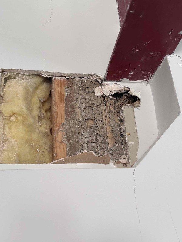 # Job Description
Responded to report of leak in garage. Upon inspection, identified active water intrusion causing structural damage to ceiling and wall assembly. Documented extensive cracking along wall-to-ceiling corner joint with visible water staining and discoloration indicating prolonged moisture exposure.
Performed exploratory opening of damaged ceiling section to assess extent of water damage and locate leak source. Removal of compromised drywall revealed saturated fiberglass insulation and affected wooden framing members. Inspected exposed ceiling joists and structural components for water damage and deterioration. Photographed conditions including compromised building materials, insulation saturation, and structural framing for documentation and further assessment.
Investigation revealed need for leak source identification and repair of water-damaged ceiling and wall materials. Recommended follow-up repairs including replacement of water-damaged drywall, insulation, and f # Job Description
Responded to report of leak in garage. Upon inspection, identified active water intrusion causing structural damage to ceiling and wall assembly. Documented extensive cracking along wall-to-ceiling corner joint with visible water staining and discoloration indicating prolonged moisture exposure.
Performed exploratory opening of damaged ceiling section to assess extent of water damage and locate leak source. Removal of compromised drywall revealed saturated fiberglass insulation and affected wooden framing members. Inspected exposed ceiling joists and structural components for water damage and deterioration. Photographed conditions including compromised building materials, insulation saturation, and structural framing for documentation and further assessment.
Investigation revealed need for leak source identification and repair of water-damaged ceiling and wall materials. Recommended follow-up repairs including replacement of water-damaged drywall, insulation, and f