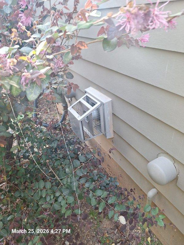 Responded to service call for direct vent water heater reported as leaking. Upon inspection, discovered the leak was originating from a toilet tank fill valve rather than the water heater system. Identified significant mineral deposits and staining around the fill valve base and connection points, indicating a chronic leak condition. The Geberit flush system components showed signs of water seepage, and the tank water level appeared discolored. Inspected the exterior direct vent termination on building exterior, which showed no signs of moisture intrusion or improper venting. Vegetation growth around the vent was noted but did not obstruct airflow. Documented conditions with photographs for customer records and provided recommendations for toilet fill valve replacement to resolve the actual source of the reported leak. Responded to service call for direct vent water heater reported as leaking. Upon inspection, discovered the leak was originating from a toilet tank fill valve rather than the water heater system. Identified significant mineral deposits and staining around the fill valve base and connection points, indicating a chronic leak condition. The Geberit flush system components showed signs of water seepage, and the tank water level appeared discolored. Inspected the exterior direct vent termination on building exterior, which showed no signs of moisture intrusion or improper venting. Vegetation growth around the vent was noted but did not obstruct airflow. Documented conditions with photographs for customer records and provided recommendations for toilet fill valve replacement to resolve the actual source of the reported leak.