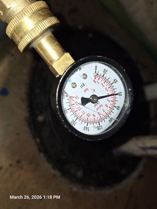 Completed water heater installation with associated pressure and expansion tank components. Installed new pressure gauge reading 0-160 PSI with brass compression fitting, mounted expansion tank with proper insulation clearance in utility area, and configured PVC drainage piping through basement framing. Verified all connections for proper operation and system pressurization. Completed water heater installation with associated pressure and expansion tank components. Installed new pressure gauge reading 0-160 PSI with brass compression fitting, mounted expansion tank with proper insulation clearance in utility area, and configured PVC drainage piping through basement framing. Verified all connections for proper operation and system pressurization.