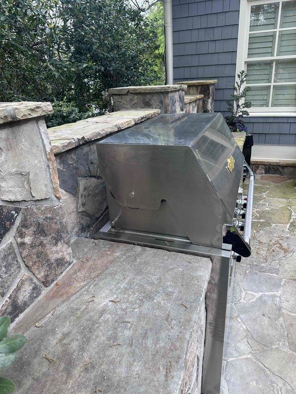 Completed gas line connection for outdoor stainless steel grill unit mounted on stone patio structure. Connected natural gas supply line to grill, ensuring proper fitting and secure connection to manufacturer specifications. Verified gas flow, tested all burner operations, and confirmed proper ignition across cooking zones. Inspected installation for safety compliance and leak-free operation. Completed gas line connection for outdoor stainless steel grill unit mounted on stone patio structure. Connected natural gas supply line to grill, ensuring proper fitting and secure connection to manufacturer specifications. Verified gas flow, tested all burner operations, and confirmed proper ignition across cooking zones. Inspected installation for safety compliance and leak-free operation.