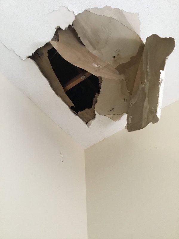 Responded to report of ceiling leak and conducted thorough inspection of affected areas. Documented extensive water damage to interior ceiling with compromised drywall, exposed structural framing, and material deterioration indicating active moisture intrusion. Traced leak source to bathroom directly above damaged ceiling area. Inspected shower and tub enclosure, identifying improper sealing around shower valve and tub spout penetrations as likely entry points for water migration. Photographed all damaged areas and plumbing fixtures for documentation purposes. Recommended immediate repairs to shower valve sealing, re-caulking of tub spout, and replacement of water-damaged ceiling drywall once source is properly remediated. Responded to report of ceiling leak and conducted thorough inspection of affected areas. Documented extensive water damage to interior ceiling with compromised drywall, exposed structural framing, and material deterioration indicating active moisture intrusion. Traced leak source to bathroom directly above damaged ceiling area. Inspected shower and tub enclosure, identifying improper sealing around shower valve and tub spout penetrations as likely entry points for water migration. Photographed all damaged areas and plumbing fixtures for documentation purposes. Recommended immediate repairs to shower valve sealing, re-caulking of tub spout, and replacement of water-damaged ceiling drywall once source is properly remediated.