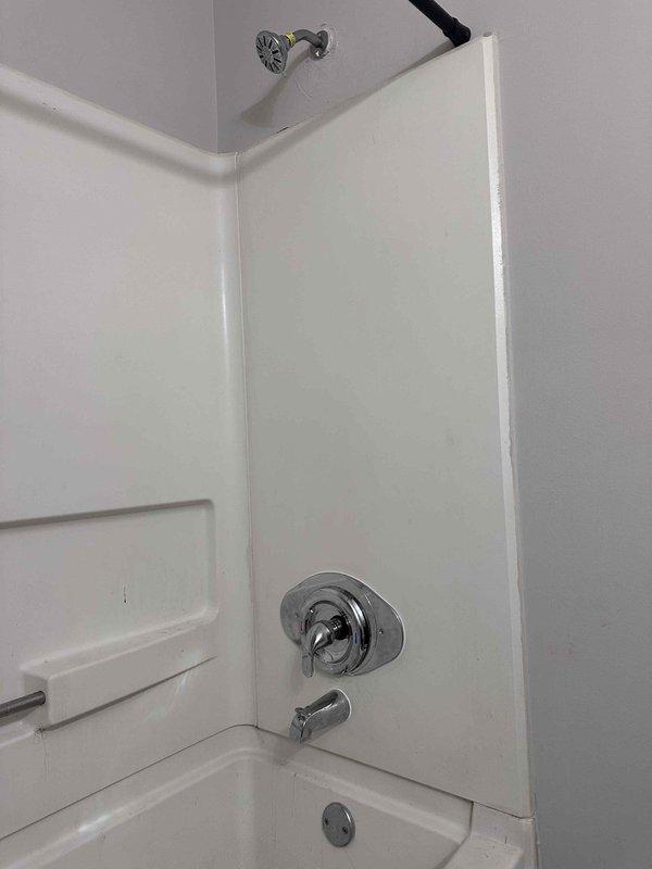Responded to emergency service call for active shower leak requiring immediate water shutoff to the residence. Upon arrival, inspected the bathroom shower and tub fixtures to identify the source of the leak. Examined the single-handle shower control valve and tub spout assembly mounted on the tiled shower wall. Diagnosed the issue with the shower valve system and performed necessary repairs to eliminate the water leak. Tested the repaired fixtures to ensure proper operation and confirmed no additional leaks were present. Restored water service to the home and verified all plumbing functions were working correctly. Left the bathroom in clean condition with fixtures operating as intended. Responded to emergency service call for active shower leak requiring immediate water shutoff to the residence. Upon arrival, inspected the bathroom shower and tub fixtures to identify the source of the leak. Examined the single-handle shower control valve and tub spout assembly mounted on the tiled shower wall. Diagnosed the issue with the shower valve system and performed necessary repairs to eliminate the water leak. Tested the repaired fixtures to ensure proper operation and confirmed no additional leaks were present. Restored water service to the home and verified all plumbing functions were working correctly. Left the bathroom in clean condition with fixtures operating as intended.
