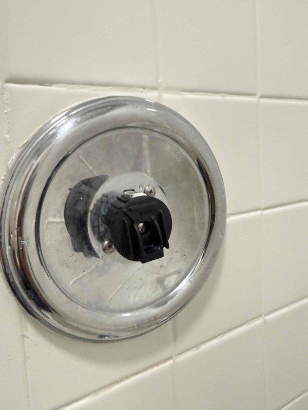 Responded to customer report of water dripping from shower faucet. Upon inspection, found heavily corroded valve cartridge with significant mineral buildup and rust accumulation around the valve assembly. Removed deteriorated cartridge, cleaned valve body and trim plate, and installed new replacement cartridge. Tested operation to verify proper function and confirmed leak was eliminated. Responded to customer report of water dripping from shower faucet. Upon inspection, found heavily corroded valve cartridge with significant mineral buildup and rust accumulation around the valve assembly. Removed deteriorated cartridge, cleaned valve body and trim plate, and installed new replacement cartridge. Tested operation to verify proper function and confirmed leak was eliminated.