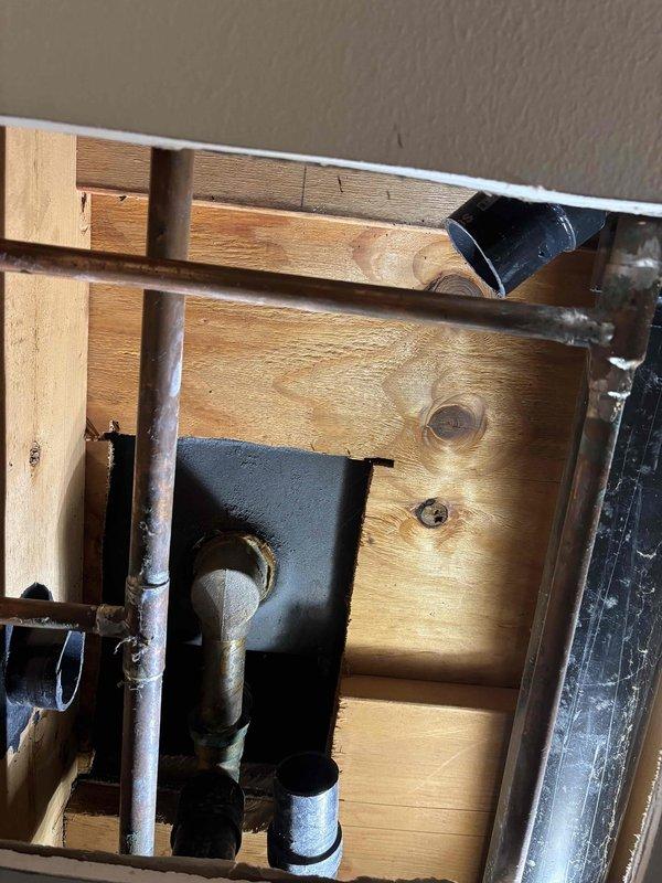 Completed drain repair work requiring access through floor cavity. Accessed and repaired copper drainage piping within structural framing, which showed signs of age and oxidation. Work necessitated opening ceiling access point to reach affected plumbing lines. Insulated exposed pipes with foam sleeves to prevent condensation and maintain proper function. Restored access point and prepared area for final finishing work. Completed drain repair work requiring access through floor cavity. Accessed and repaired copper drainage piping within structural framing, which showed signs of age and oxidation. Work necessitated opening ceiling access point to reach affected plumbing lines. Insulated exposed pipes with foam sleeves to prevent condensation and maintain proper function. Restored access point and prepared area for final finishing work.