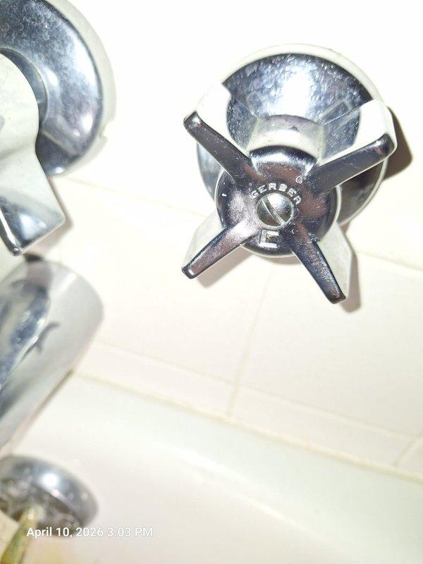 Responded to water department notice regarding continuous water flow at property. Upon inspection, identified leaking bathtub faucet assembly with three-valve cross-handle configuration as source of constant water flow. Tub showed significant rust-colored staining and mineral deposit buildup around drain area, indicating prolonged water seepage. Repaired faulty valve stem washers and seats on the affected fixture, restoring proper shutoff function and eliminating continuous water flow condition. Responded to water department notice regarding continuous water flow at property. Upon inspection, identified leaking bathtub faucet assembly with three-valve cross-handle configuration as source of constant water flow. Tub showed significant rust-colored staining and mineral deposit buildup around drain area, indicating prolonged water seepage. Repaired faulty valve stem washers and seats on the affected fixture, restoring proper shutoff function and eliminating continuous water flow condition.