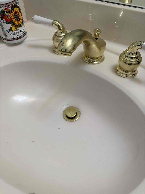 Performed smoke test on plumbing system as specified in approved quote. Conducted thorough inspection of bathroom sink installation, including brass three-piece faucet set with ornate fixtures and white porcelain accents. Documented existing conditions with photographic evidence showing proper drain assembly and fixture positioning. Performed smoke test on plumbing system as specified in approved quote. Conducted thorough inspection of bathroom sink installation, including brass three-piece faucet set with ornate fixtures and white porcelain accents. Documented existing conditions with photographic evidence showing proper drain assembly and fixture positioning.