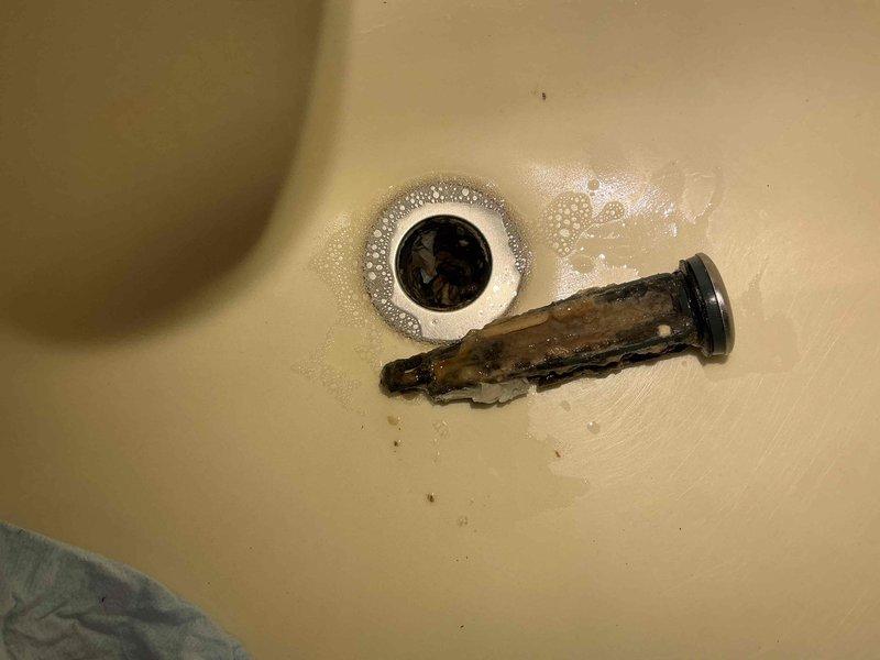 Responded to a clogged bathroom sink drain at a residential property. Upon inspection, discovered a heavily corroded drain stopper mechanism causing the blockage. Removed the deteriorated component, which showed significant rust and mineral buildup from prolonged water exposure, cleared the drain opening, and restored proper water flow to the sink. Responded to a clogged bathroom sink drain at a residential property. Upon inspection, discovered a heavily corroded drain stopper mechanism causing the blockage. Removed the deteriorated component, which showed significant rust and mineral buildup from prolonged water exposure, cleared the drain opening, and restored proper water flow to the sink.