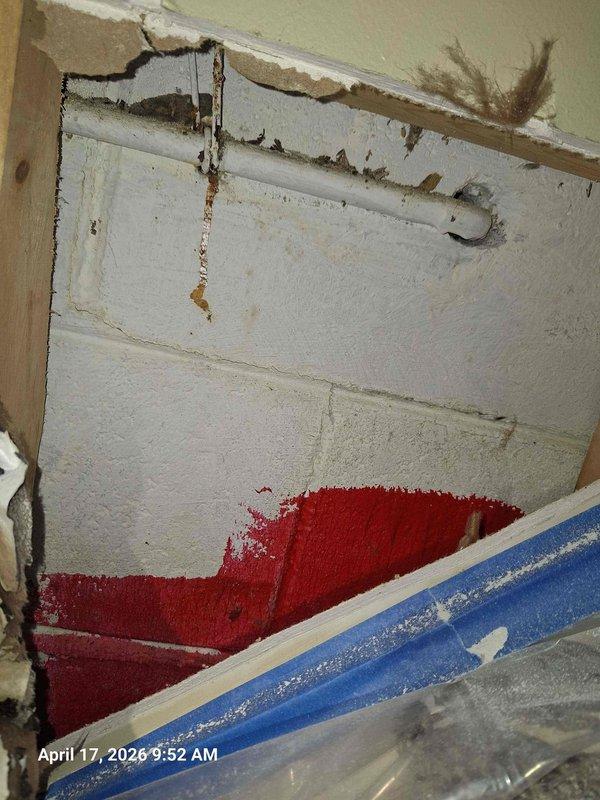 Responded to service call for non-functional exterior hose bibb. Upon arrival, performed comprehensive assessment of outdoor water spigot mounted on exterior wall with blue handle valve. Conducted thorough inspection of fixture, wall penetration point, and surrounding area to identify root cause of malfunction. Examined interior wall cavity behind hose bibb location, which revealed significant water damage to drywall and structural deterioration at ceiling-wall junction. Documented extensive damage including compromised drywall, exposed framing, and evidence of long-term moisture intrusion. Photographed both exterior spigot condition and interior water damage for detailed assessment. Provided professional evaluation and free estimate for necessary repairs to restore proper function and address underlying water damage issues. Responded to service call for non-functional exterior hose bibb. Upon arrival, performed comprehensive assessment of outdoor water spigot mounted on exterior wall with blue handle valve. Conducted thorough inspection of fixture, wall penetration point, and surrounding area to identify root cause of malfunction. Examined interior wall cavity behind hose bibb location, which revealed significant water damage to drywall and structural deterioration at ceiling-wall junction. Documented extensive damage including compromised drywall, exposed framing, and evidence of long-term moisture intrusion. Photographed both exterior spigot condition and interior water damage for detailed assessment. Provided professional evaluation and free estimate for necessary repairs to restore proper function and address underlying water damage issues.