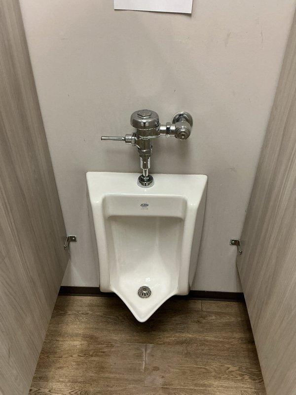 Completed urinal rebuild in commercial restroom facility. Removed and replaced existing flush valve assembly with new chrome flush mechanism, ensuring proper water flow and manual flush handle operation. Verified secure mounting of urinal to wall, inspected all piping connections for leaks, and tested flush valve functionality. All components operating correctly upon completion. Completed urinal rebuild in commercial restroom facility. Removed and replaced existing flush valve assembly with new chrome flush mechanism, ensuring proper water flow and manual flush handle operation. Verified secure mounting of urinal to wall, inspected all piping connections for leaks, and tested flush valve functionality. All components operating correctly upon completion.