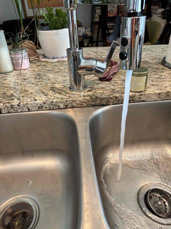 Responded to service call for leaking kitchen faucet. Removed existing faucet assembly and installed customer-supplied chrome pull-down spray faucet on double-basin stainless steel sink with granite countertop. Tested water flow and verified proper operation with no leaks detected upon completion. Responded to service call for leaking kitchen faucet. Removed existing faucet assembly and installed customer-supplied chrome pull-down spray faucet on double-basin stainless steel sink with granite countertop. Tested water flow and verified proper operation with no leaks detected upon completion.