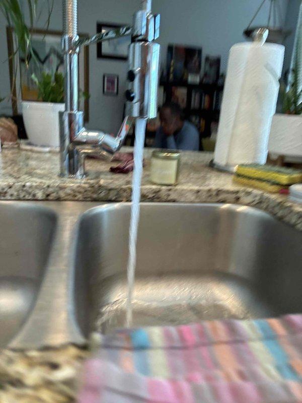 Responded to service call for leaking kitchen faucet. Removed existing faucet assembly and installed customer-supplied chrome pull-down spray faucet on double-basin stainless steel sink with granite countertop. Tested water flow and verified proper operation with no leaks detected upon completion. Responded to service call for leaking kitchen faucet. Removed existing faucet assembly and installed customer-supplied chrome pull-down spray faucet on double-basin stainless steel sink with granite countertop. Tested water flow and verified proper operation with no leaks detected upon completion.