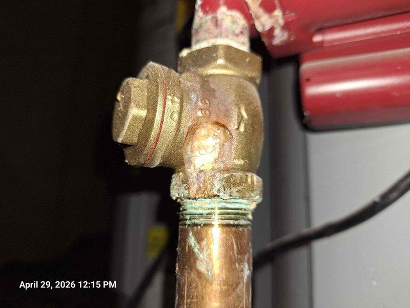 # Pressure Issue Resolution
Responded to multiple shower pressure and operational concerns throughout the residence. Inspected hot water circulation system and identified corroded brass fittings with significant mineral buildup affecting water flow. The circulation pump showed signs of age with visible corrosion on connected brass components and copper piping.
Addressed non-functional shower head in double shower head installation. Investigated low water pressure issue in second bathroom shower, which also presented sewer odor concerns requiring drain system evaluation. Examined third shower experiencing temperature fluctuation problems, likely related to pressure balance valve or hot water circulation system performance.
Documentation revealed heavy mineral deposits and corrosion on brass T-fittings and elbow connections in the hot water circulation assembly. The deterioration of threaded connections and presence of white crusty formations indicated potential water leakage or conde # Pressure Issue Resolution
Responded to multiple shower pressure and operational concerns throughout the residence. Inspected hot water circulation system and identified corroded brass fittings with significant mineral buildup affecting water flow. The circulation pump showed signs of age with visible corrosion on connected brass components and copper piping.
Addressed non-functional shower head in double shower head installation. Investigated low water pressure issue in second bathroom shower, which also presented sewer odor concerns requiring drain system evaluation. Examined third shower experiencing temperature fluctuation problems, likely related to pressure balance valve or hot water circulation system performance.
Documentation revealed heavy mineral deposits and corrosion on brass T-fittings and elbow connections in the hot water circulation assembly. The deterioration of threaded connections and presence of white crusty formations indicated potential water leakage or conde