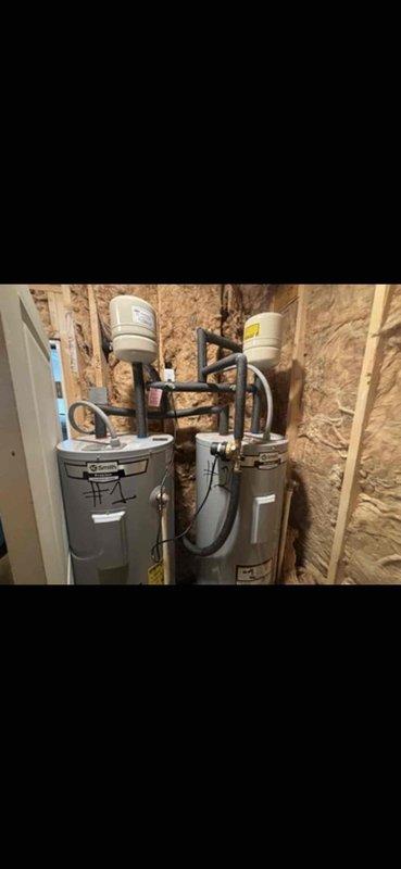 Completed installation of tankless water heating system in residential utility space. Removed existing tank-style water heaters and installed new wall-mounted tankless unit with integrated expansion tank, copper supply lines, and proper venting. Configured plumbing connections, mounted unit to structural framing with appropriate backing, and verified all gas lines, water connections, and electrical components were properly installed and functioning to manufacturer specifications. Completed installation of tankless water heating system in residential utility space. Removed existing tank-style water heaters and installed new wall-mounted tankless unit with integrated expansion tank, copper supply lines, and proper venting. Configured plumbing connections, mounted unit to structural framing with appropriate backing, and verified all gas lines, water connections, and electrical components were properly installed and functioning to manufacturer specifications.
