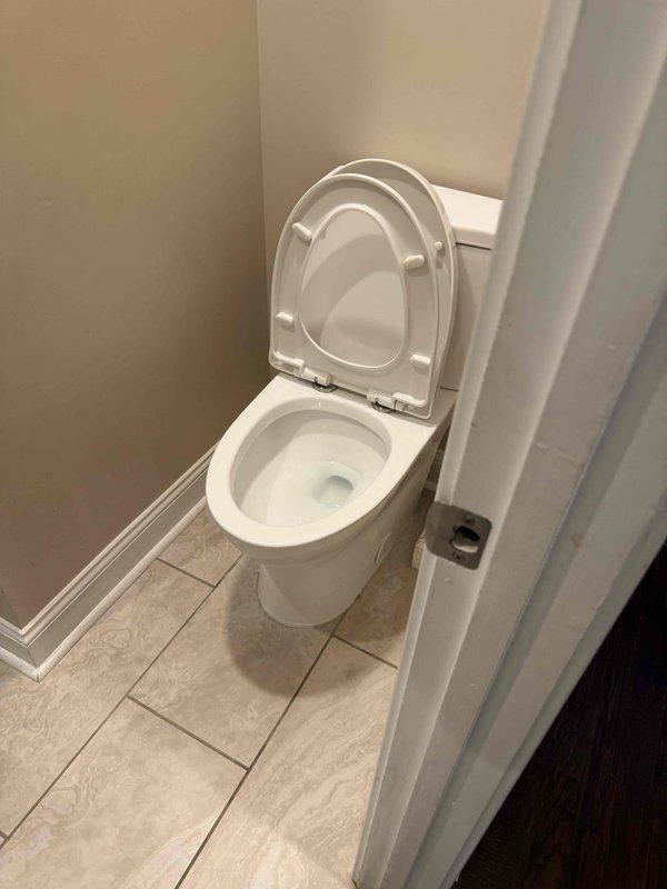 Responded to a clogged basement toilet that was backing up into the adjacent shower drain. Successfully cleared the blockage and restored proper drainage to both fixtures. The bathroom is equipped with fixtures that may require a sewage ejection pump system for optimal long-term performance, as previously assessed.