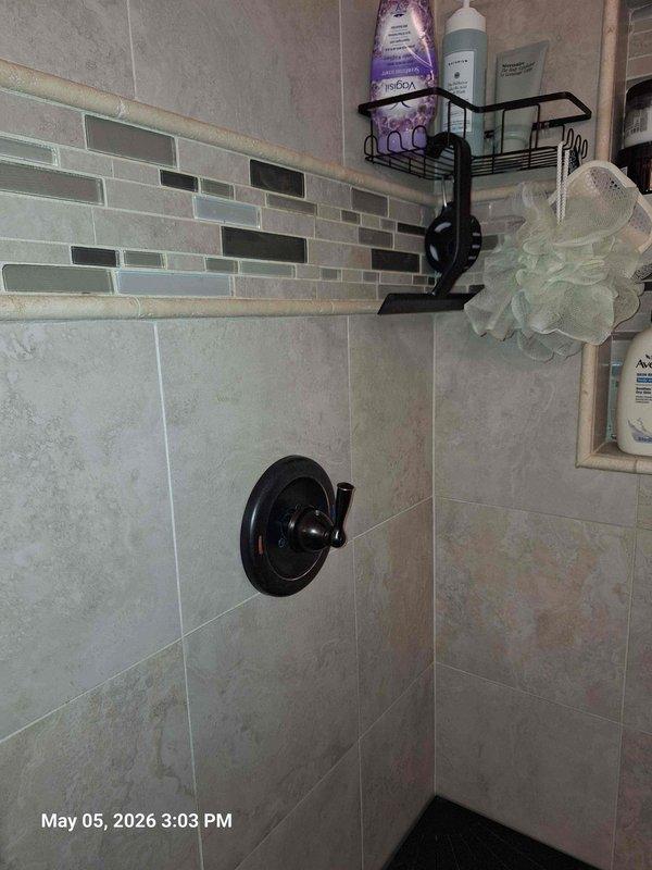 Responded to service call for shower not functioning properly. Upon inspection, diagnosed issue with water circulation system affecting hot water delivery to the shower. Examined plumbing infrastructure including circulation pump, pressure tank, and water heater connections. Verified proper operation of Watts circulation pump and checked all associated piping for potential restrictions or failures. Inspected shower valve assembly and control mechanism in tiled shower enclosure to ensure proper functionality. Tested water flow and temperature regulation at the fixture. Documented existing mechanical systems and shower installation with photographs for service records. Restored shower to proper working condition and confirmed adequate hot water delivery and pressure at the fixture. Responded to service call for shower not functioning properly. Upon inspection, diagnosed issue with water circulation system affecting hot water delivery to the shower. Examined plumbing infrastructure including circulation pump, pressure tank, and water heater connections. Verified proper operation of Watts circulation pump and checked all associated piping for potential restrictions or failures. Inspected shower valve assembly and control mechanism in tiled shower enclosure to ensure proper functionality. Tested water flow and temperature regulation at the fixture. Documented existing mechanical systems and shower installation with photographs for service records. Restored shower to proper working condition and confirmed adequate hot water delivery and pressure at the fixture.