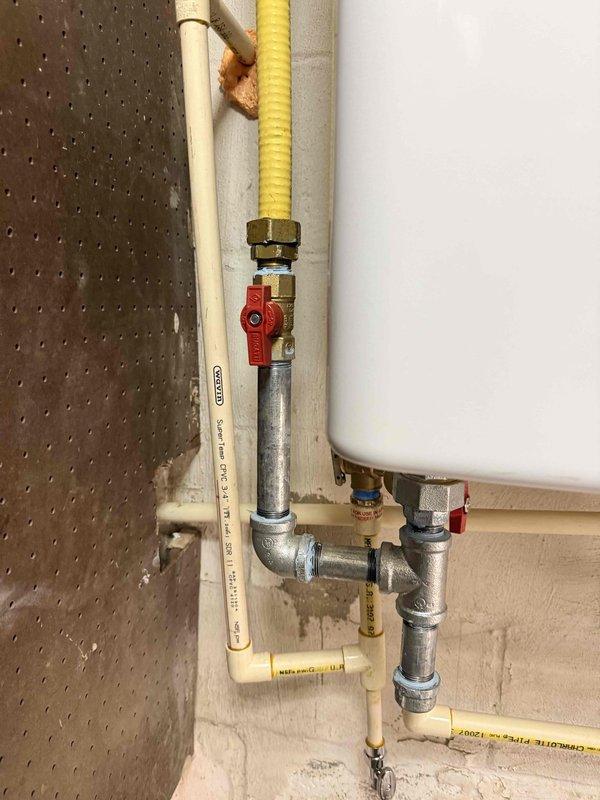 Responded to service call for non-operational tankless water heater that had experienced prior flood damage. Removed and disposed of existing failed unit. Installed replacement water heater with new gas line connections, water supply lines, and proper venting system. Configured all plumbing connections including hot and cold water lines with appropriate shut-off valves for future serviceability. System tested and confirmed operational upon completion. Responded to service call for non-operational tankless water heater that had experienced prior flood damage. Removed and disposed of existing failed unit. Installed replacement water heater with new gas line connections, water supply lines, and proper venting system. Configured all plumbing connections including hot and cold water lines with appropriate shut-off valves for future serviceability. System tested and confirmed operational upon completion.