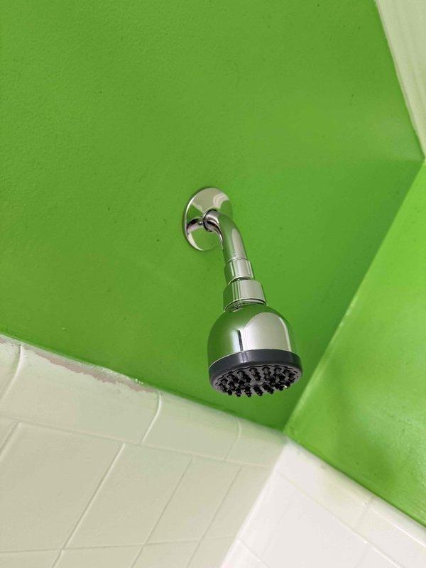 Completed plumbing repairs and fixture installation per approved quote specifications. Installed new chrome shower head assembly with multi-spray functionality, including wall-mounted bracket and curved supply arm, with proper sealing and alignment on tiled bathroom wall. Inspected and addressed pipe penetration through wall material where deterioration was present, ensuring proper fit and structural integrity. Performed inspection of pop-up drain assembly as requested to verify operational condition and proper function. Completed plumbing repairs and fixture installation per approved quote specifications. Installed new chrome shower head assembly with multi-spray functionality, including wall-mounted bracket and curved supply arm, with proper sealing and alignment on tiled bathroom wall. Inspected and addressed pipe penetration through wall material where deterioration was present, ensuring proper fit and structural integrity. Performed inspection of pop-up drain assembly as requested to verify operational condition and proper function.