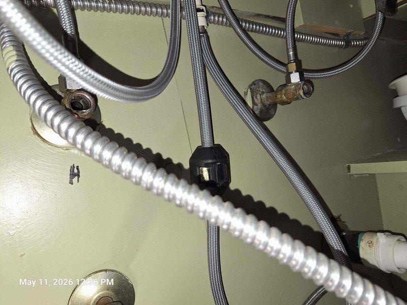 Responded to plumbing repair request for kitchen sink faucet with non-functioning retractable spray hose. Located and shut off main water supply to the sink, as individual fixture shutoff valves were inoperable. Removed existing retractable hose assembly and installed customer-provided replacement hose. Restored water supply and verified proper operation of new hose with no leaks detected. Confirmed water pressure readings were within normal operating range and all connections were secure. Responded to plumbing repair request for kitchen sink faucet with non-functioning retractable spray hose. Located and shut off main water supply to the sink, as individual fixture shutoff valves were inoperable. Removed existing retractable hose assembly and installed customer-provided replacement hose. Restored water supply and verified proper operation of new hose with no leaks detected. Confirmed water pressure readings were within normal operating range and all connections were secure.