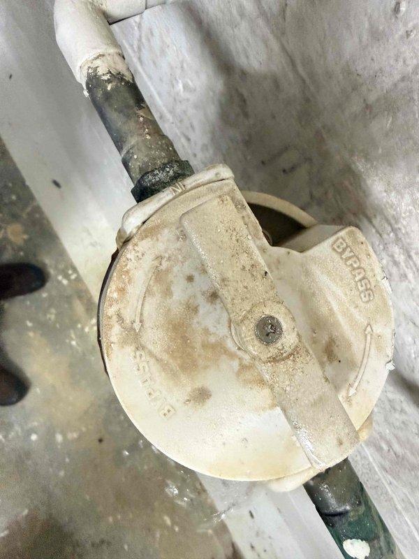 Responded to service call for multiple water leaks at residential property. Inspected and documented hydration room where broken connection was identified through drainage system filter, causing active water intrusion. Evaluated outdoor spigot with confirmed leak and assessed water meter box found completely filled with water. Photographic documentation captured water heater installation area showing significant moisture damage to baseboards and flooring, along with corrosion on tank base and surrounding plumbing connections. Additional images documented drainage system valve component with visible wear and discoloration on PVC connections. Provided comprehensive estimate for repair of broken drainage connection, outdoor spigot replacement, and water meter box remediation to resolve all identified leak sources. Responded to service call for multiple water leaks at residential property. Inspected and documented hydration room where broken connection was identified through drainage system filter, causing active water intrusion. Evaluated outdoor spigot with confirmed leak and assessed water meter box found completely filled with water. Photographic documentation captured water heater installation area showing significant moisture damage to baseboards and flooring, along with corrosion on tank base and surrounding plumbing connections. Additional images documented drainage system valve component with visible wear and discoloration on PVC connections. Provided comprehensive estimate for repair of broken drainage connection, outdoor spigot replacement, and water meter box remediation to resolve all identified leak sources.