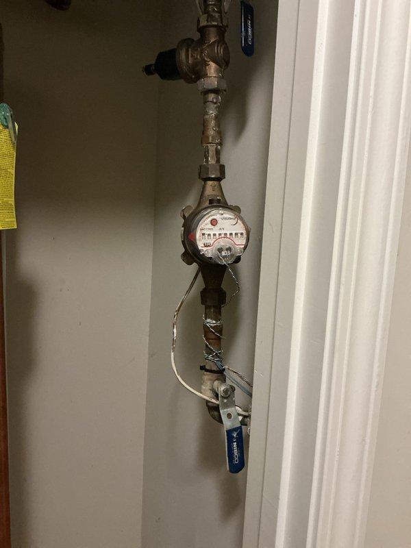 Responded to plumbing issue following customer's dishwasher installation where hot water was improperly flowing to the adjacent kitchen sink and the shut-off valve was failing to completely stop water flow. Inspected the plumbing connections at the water heater and main water supply assembly, documented the valve configuration and water meter installation with photos, and assessed the shut-off valve condition to determine the cause of the incomplete water shut-off. Responded to plumbing issue following customer's dishwasher installation where hot water was improperly flowing to the adjacent kitchen sink and the shut-off valve was failing to completely stop water flow. Inspected the plumbing connections at the water heater and main water supply assembly, documented the valve configuration and water meter installation with photos, and assessed the shut-off valve condition to determine the cause of the incomplete water shut-off.