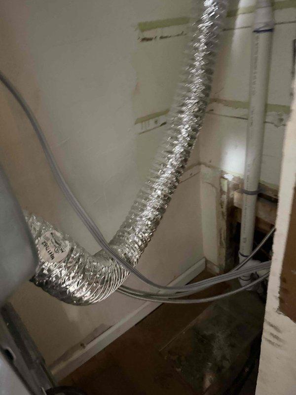 Completed rework of drain line system as specified in approved quote. Relocated and reconfigured PVC drain piping in utility closet area adjacent to stacked Maytag washer and dryer installation, ensuring proper drainage flow and code compliance. All work performed according to specifications with plumbing system tested and verified operational upon completion. Completed rework of drain line system as specified in approved quote. Relocated and reconfigured PVC drain piping in utility closet area adjacent to stacked Maytag washer and dryer installation, ensuring proper drainage flow and code compliance. All work performed according to specifications with plumbing system tested and verified operational upon completion.