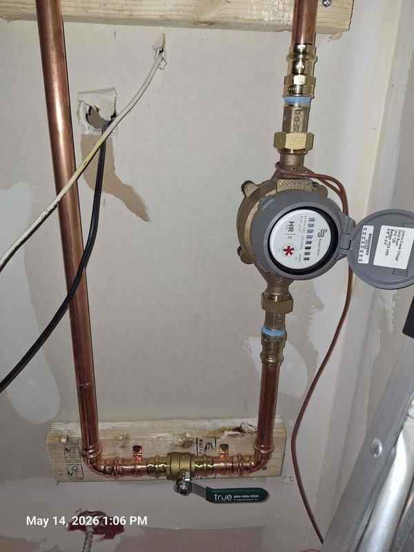 Installed residential water sub-metering system per approved quote specifications. Mounted dual water meters with brass valve assemblies and copper pipe connections on interior wall, complete with electronic monitoring devices and associated wiring. Installed control box with electrical connections to support remote monitoring capabilities for the metering system. Installed residential water sub-metering system per approved quote specifications. Mounted dual water meters with brass valve assemblies and copper pipe connections on interior wall, complete with electronic monitoring devices and associated wiring. Installed control box with electrical connections to support remote monitoring capabilities for the metering system.
