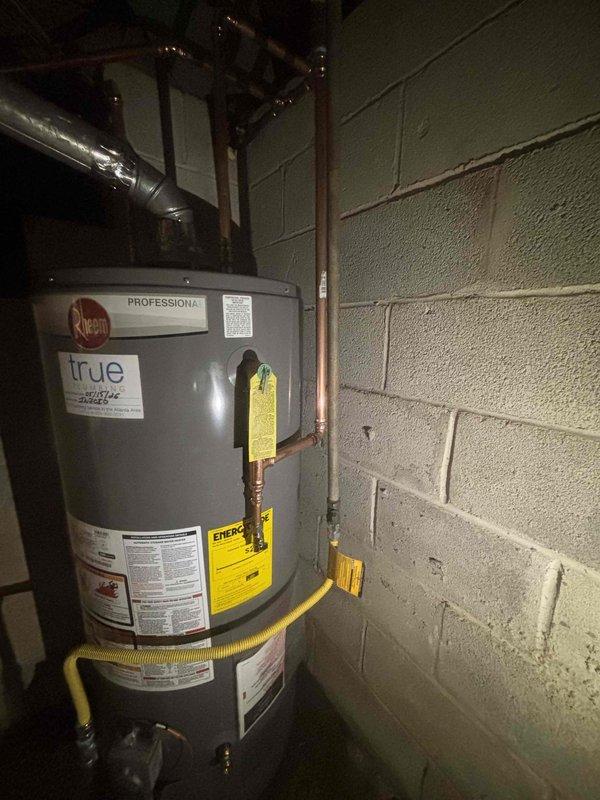 Installed 40-gallon gas water heater in basement utility area per previously provided quote. Connected copper supply lines with proper fittings and mounting brackets, installed flexible yellow gas connector line, and secured all plumbing connections to code. Unit is a Rheem Professional series model, properly vented and operational. Installed 40-gallon gas water heater in basement utility area per previously provided quote. Connected copper supply lines with proper fittings and mounting brackets, installed flexible yellow gas connector line, and secured all plumbing connections to code. Unit is a Rheem Professional series model, properly vented and operational.