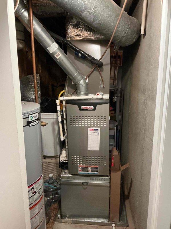 Responded to service call for upstairs unit not operating properly. Performed comprehensive tune-up and maintenance on all three HVAC systems: indoor Lennox furnace unit located in utility closet and two outdoor Lennox air conditioning condensers positioned at exterior stone wall. Conducted full system diagnostics on upstairs unit, inspected and cleaned all equipment, checked refrigerant levels and pressures, verified electrical connections, tested thermostat operations, examined ductwork and airflow, and ensured all units were operating within manufacturer specifications. All systems tested and confirmed operational upon completion. Responded to service call for upstairs unit not operating properly. Performed comprehensive tune-up and maintenance on all three HVAC systems: indoor Lennox furnace unit located in utility closet and two outdoor Lennox air conditioning condensers positioned at exterior stone wall. Conducted full system diagnostics on upstairs unit, inspected and cleaned all equipment, checked refrigerant levels and pressures, verified electrical connections, tested thermostat operations, examined ductwork and airflow, and ensured all units were operating within manufacturer specifications. All systems tested and confirmed operational upon completion.