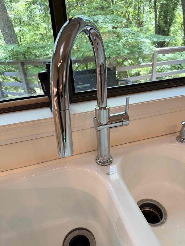 Installed customer-supplied chrome kitchen faucet with pull-down sprayer on white countertop with undermount sink. Addressed running toilets, repaired broken hosebibb handle, and diagnosed low water pressure issue at exterior hosebibb. All plumbing fixtures tested and verified operational upon completion. Installed customer-supplied chrome kitchen faucet with pull-down sprayer on white countertop with undermount sink. Addressed running toilets, repaired broken hosebibb handle, and diagnosed low water pressure issue at exterior hosebibb. All plumbing fixtures tested and verified operational upon completion.