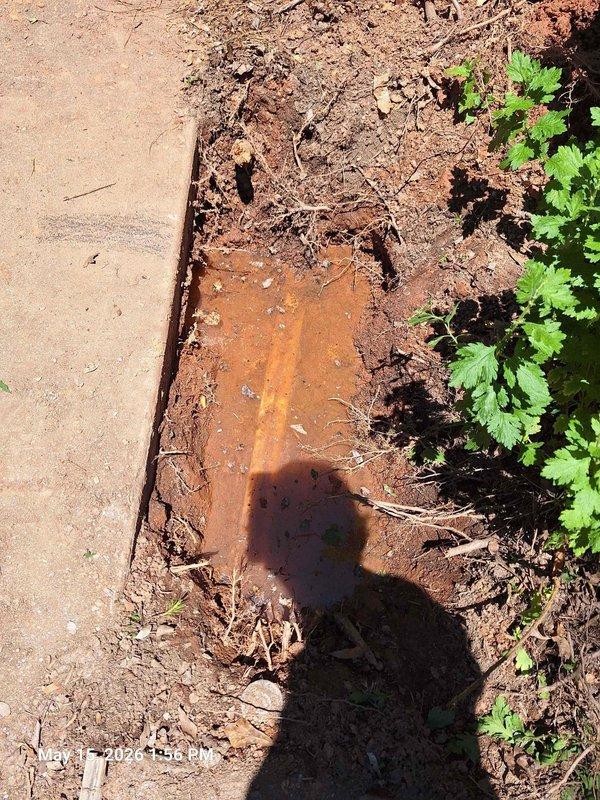 Responded to customer report of water pooling in yard indicating potential water line leak. Upon inspection, located compromised water line with visible rust deterioration and soil saturation around the affected area. Accessed utility box to assess valve assembly and pipe fittings, documented extensive corrosion on metal components and confirmed active leak requiring full water line replacement.