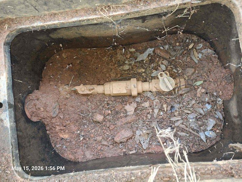 Responded to customer report of water pooling in yard indicating potential water line leak. Upon inspection, located compromised water line with visible rust deterioration and soil saturation around the affected area. Accessed utility box to assess valve assembly and pipe fittings, documented extensive corrosion on metal components and confirmed active leak requiring full water line replacement.