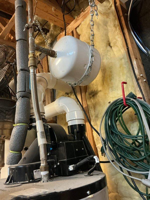 Responded to customer complaint of high-pitched noise in plumbing system. Upon inspection, diagnosed water hammer and excessive system pressure as the source of the screaming pipe sounds. Inspected pressure regulation equipment in basement mechanical room, including PASCO pressure gauge reading and PRV assembly with brass fittings, as well as attic-mounted well pump system with pressure tank and associated piping. Documented existing equipment conditions and pressure readings to determine appropriate corrective measures for eliminating noise and protecting plumbing fixtures from pressure-related damage.
