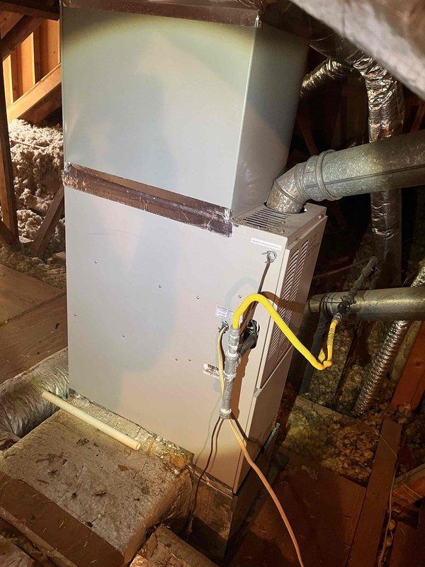 Performed comprehensive second opinion evaluation of residential HVAC system following reports of potential refrigerant leak from another contractor. Inspected Carrier furnace unit located in basement mechanical room and air handler installed in attic space. Connected manifold gauges to air handler to assess refrigerant pressures and system performance. Examined all accessible refrigerant lines, connections, and components for signs of leakage or damage. Evaluated ductwork connections, insulation integrity, and overall system installation quality. Documented equipment condition and findings with photographs for customer reference.