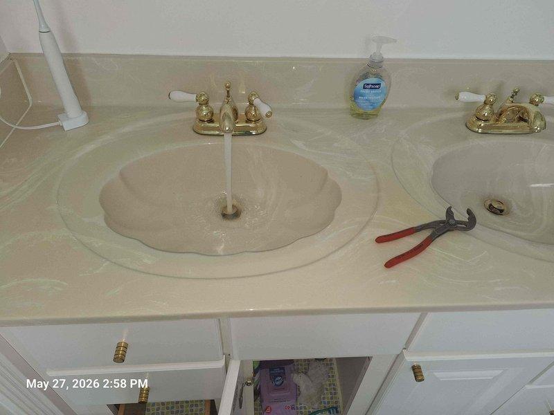 Completed comprehensive plumbing and gas system corrections to bring multiple components into code compliance and restore proper functionality. Replaced the PVC discharge pipe on the hot water heater with approved copper or CPVC material meeting current safety standards. Installed code-compliant sediment traps of proper length on both the hot water heater gas line and the attic furnace gas pipe. Addressed drainage issues in the primary bathroom by clearing blockages from the drainage lines to restore proper flow. Secured the hallway bathroom toilet properly to the floor and replaced the wax ring to ensure a watertight seal and stable installation.