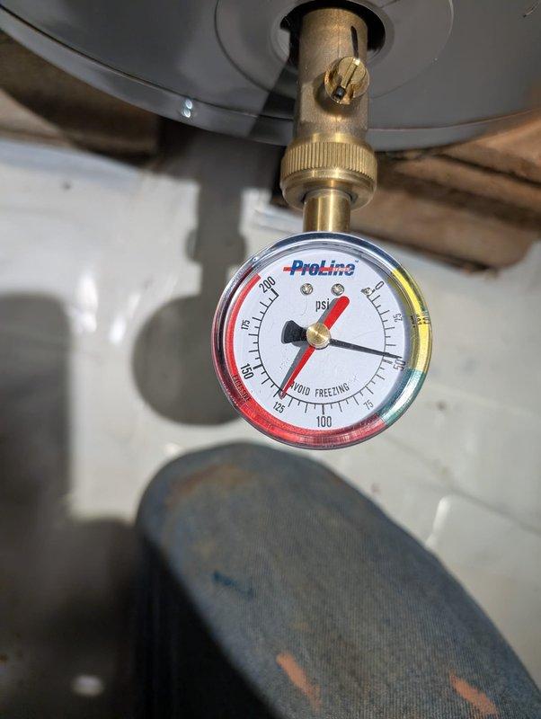 Responded to service call for detached garbage disposal unit. Upon arrival, found disposal had separated from sink mounting assembly. Reinstalled garbage disposal, securing mounting flange and ensuring proper connection to drain line. Verified disposal operation and checked for leaks. Also inspected water heater system pressure, confirming gauge readings within normal operating range.
