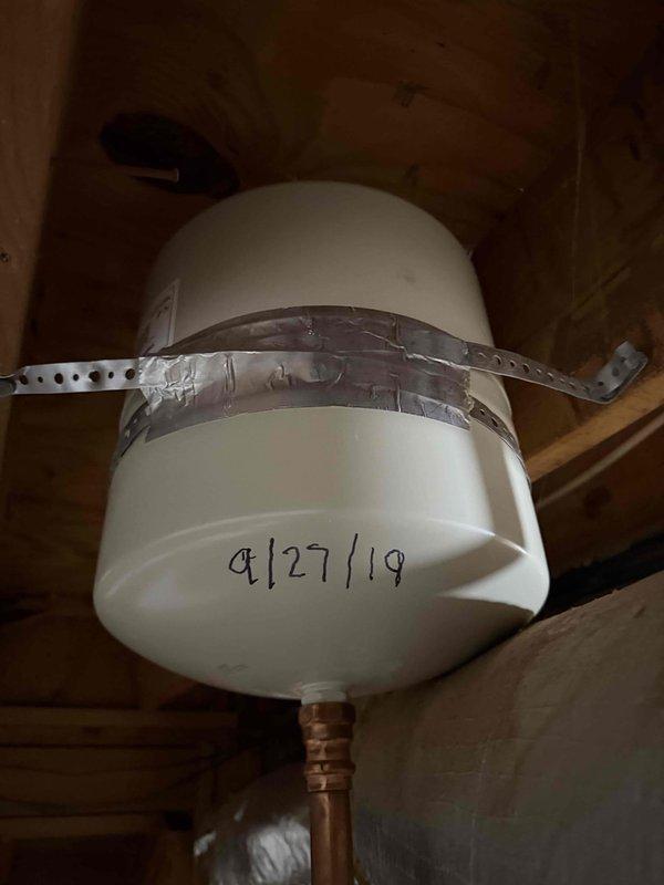 Replaced 20-year-old 50-gallon gas water heater with new unit as part of pre-sale home preparation. New water heater was properly strapped and secured to wooden framing per code requirements, with all gas connections and pressure tested to verify safe operation.