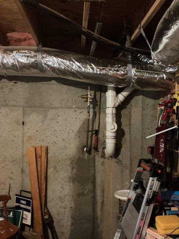 Conducted on-site assessment of existing 50-gallon gas water heater in basement utility area for replacement estimate. Inspected current installation including gas line connections, venting system with flexible ductwork, plumbing connections, and clearance requirements in unfinished basement space with exposed framing and insulation. Documented equipment condition, manufacturer specifications, and existing infrastructure to provide accurate replacement recommendations.