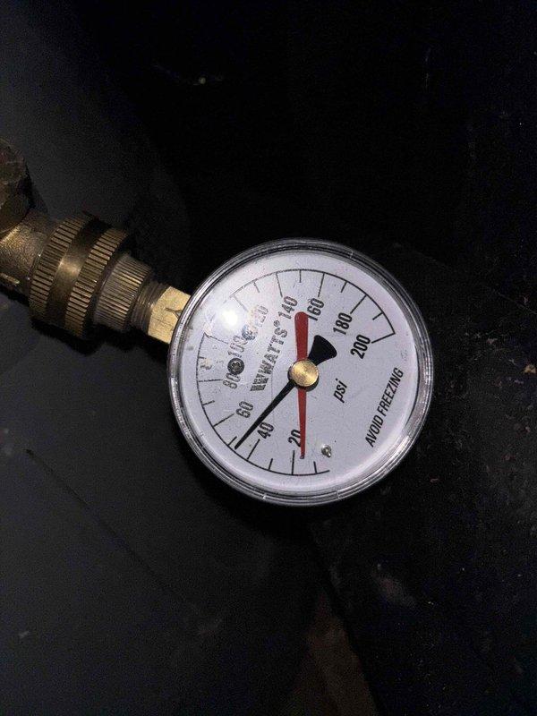 Responded to service call for non-functioning toilet with inoperative flush handle. Upon arrival, found water supply already shut off by customer. Inspected toilet tank components and tested water pressure at 80 PSI using calibrated pressure gauge. Examined American Standard toilet tank interior, identifying worn flush valve assembly and associated hardware requiring attention. Discussed customer-supplied water filtration system installation as additional requested service for future scheduling.