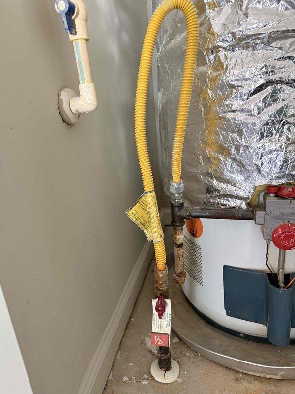 Completed estimate for property sale preparation involving replacement of corroded plumbing pipes, aging gas water heater with associated flexible gas line connections, and repair of multiple leaky faucets throughout the residence. Assessment included inspection of existing utility area installation with white PVC drainage assembly, yellow corrugated CSST gas line with brass fittings and red shut-off valves, water heater with safety controls, expansion tank with black piping connections, and aluminum HVAC ductwork.